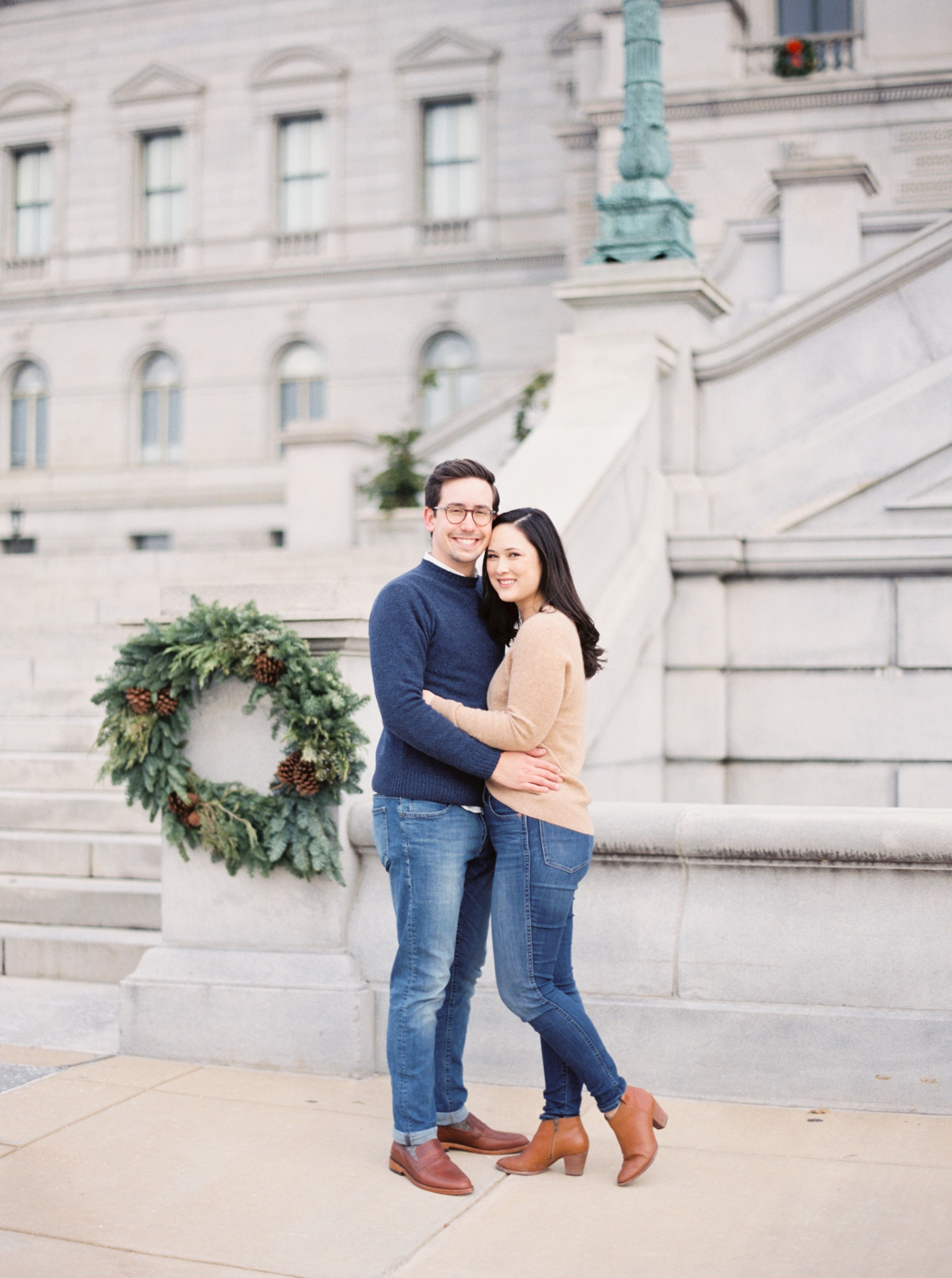 Couple smiling at the camera at the front of the Library of Congress in Washington DC