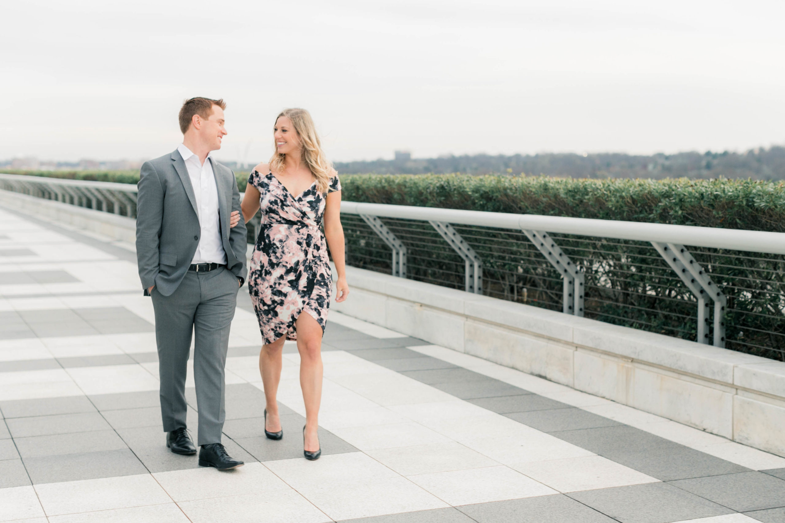 A couple strolls along the rooftop terrace of the Kennedy Center Washington DC