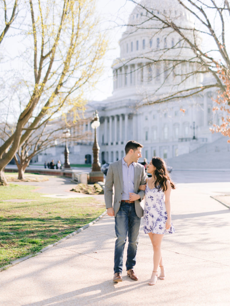 Couple strolls together in front of the Capitol Building in Washington DC