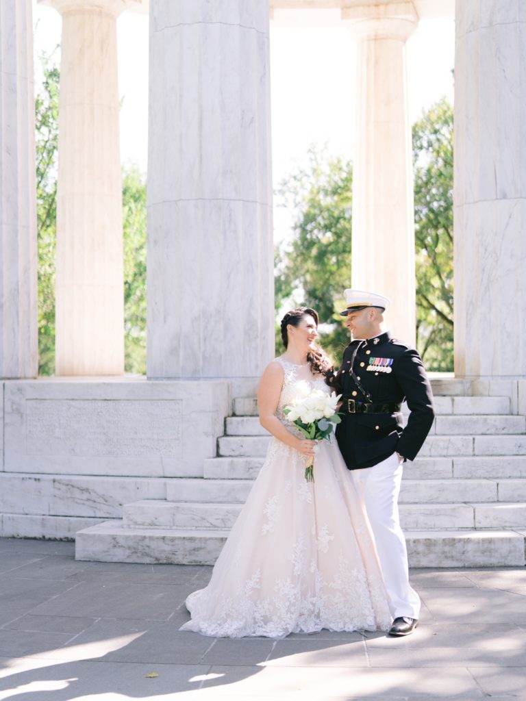 bride and groom in front of the war memorial