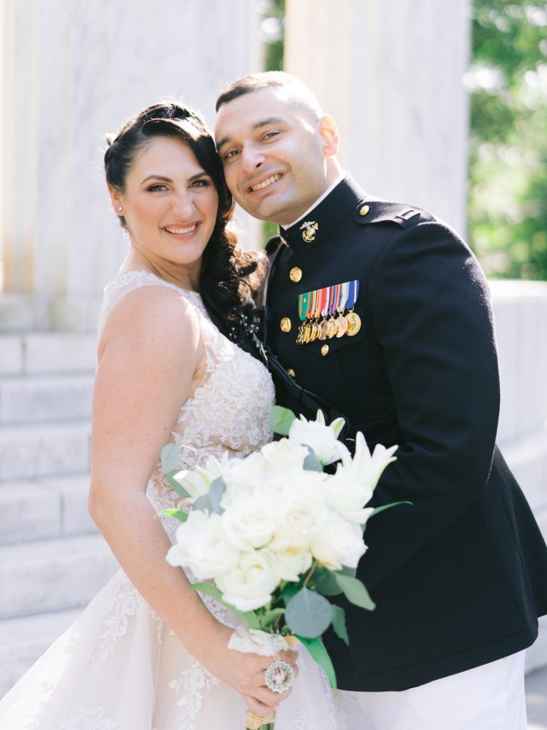 bride and groom in front of the war memorial
