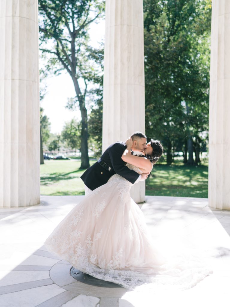bride and groom kissing in the war memorial