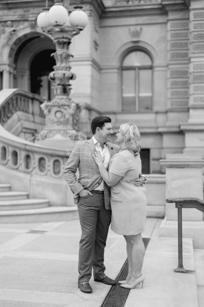 engaged Couple smiling at eachother at the library of congress in washington dc