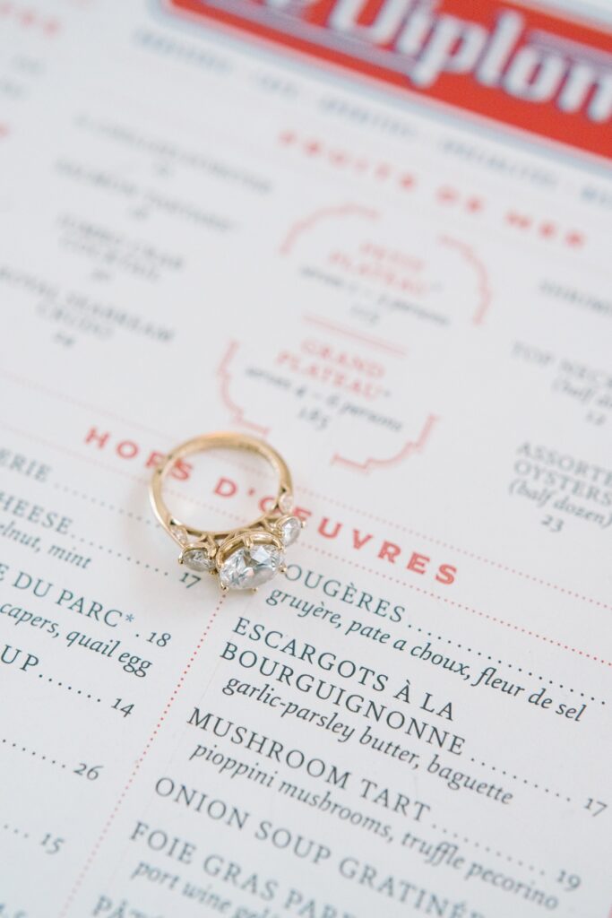 engagement ring on a menu at Le Diplomate in Washington DC