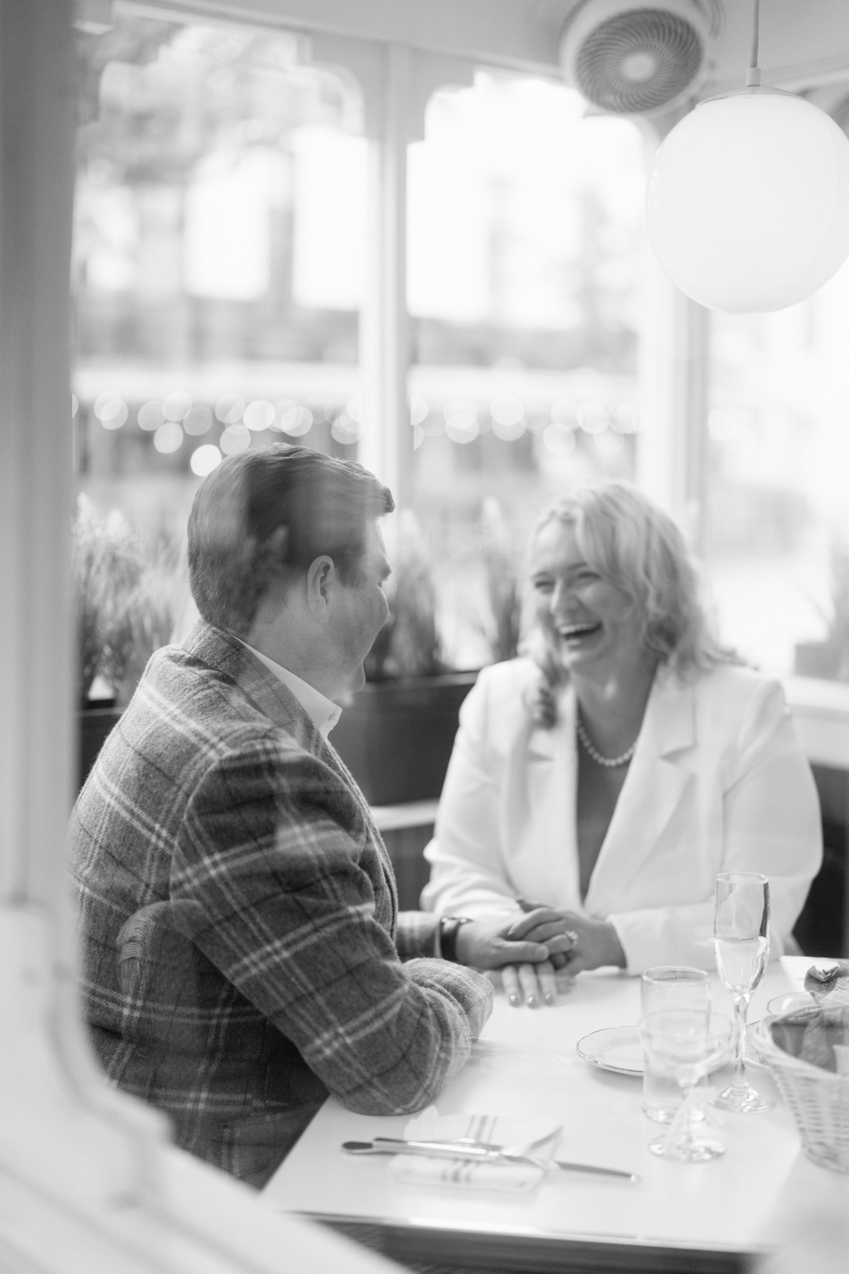 engaged couple laughing at Le Diplomate in Washington DC