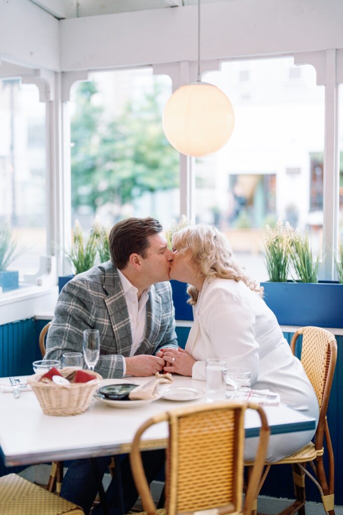engaged couple kissing at Le Diplomate in Washington DC