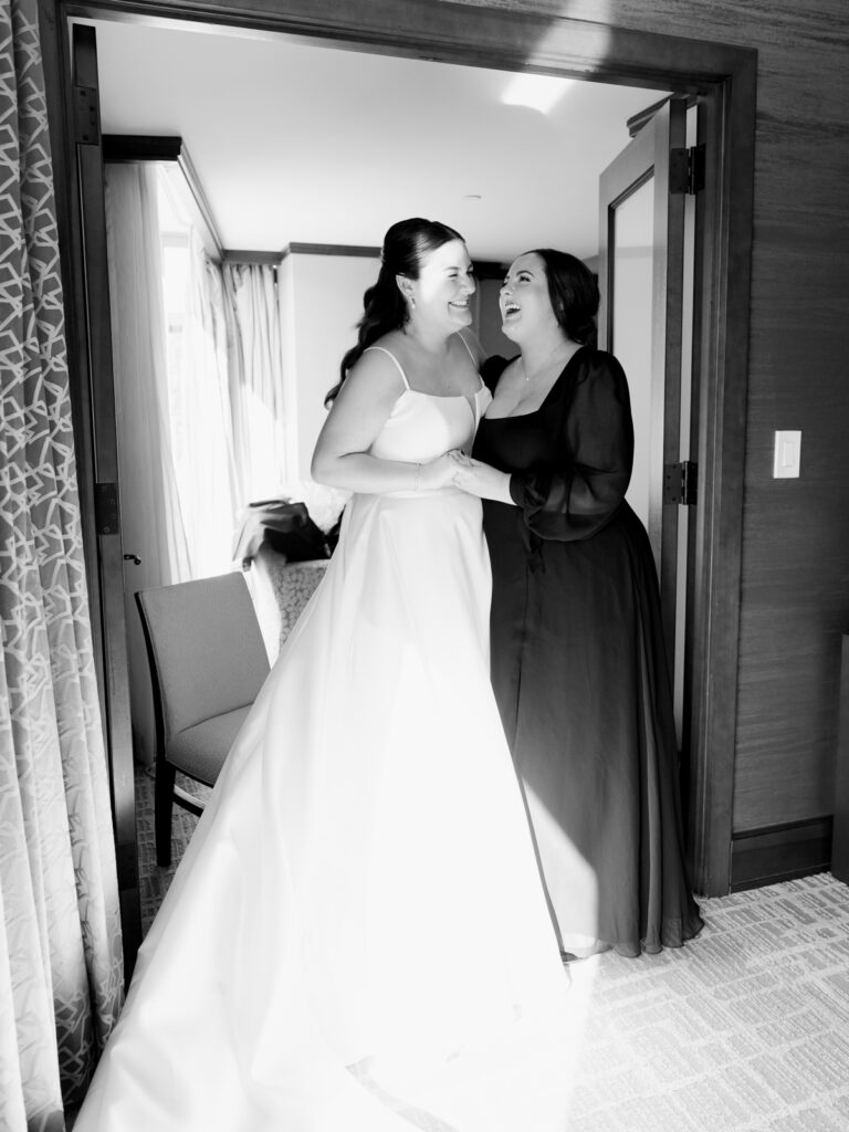 bride and maid of honor laughing at the Ritz carlton georgetown in washington dc