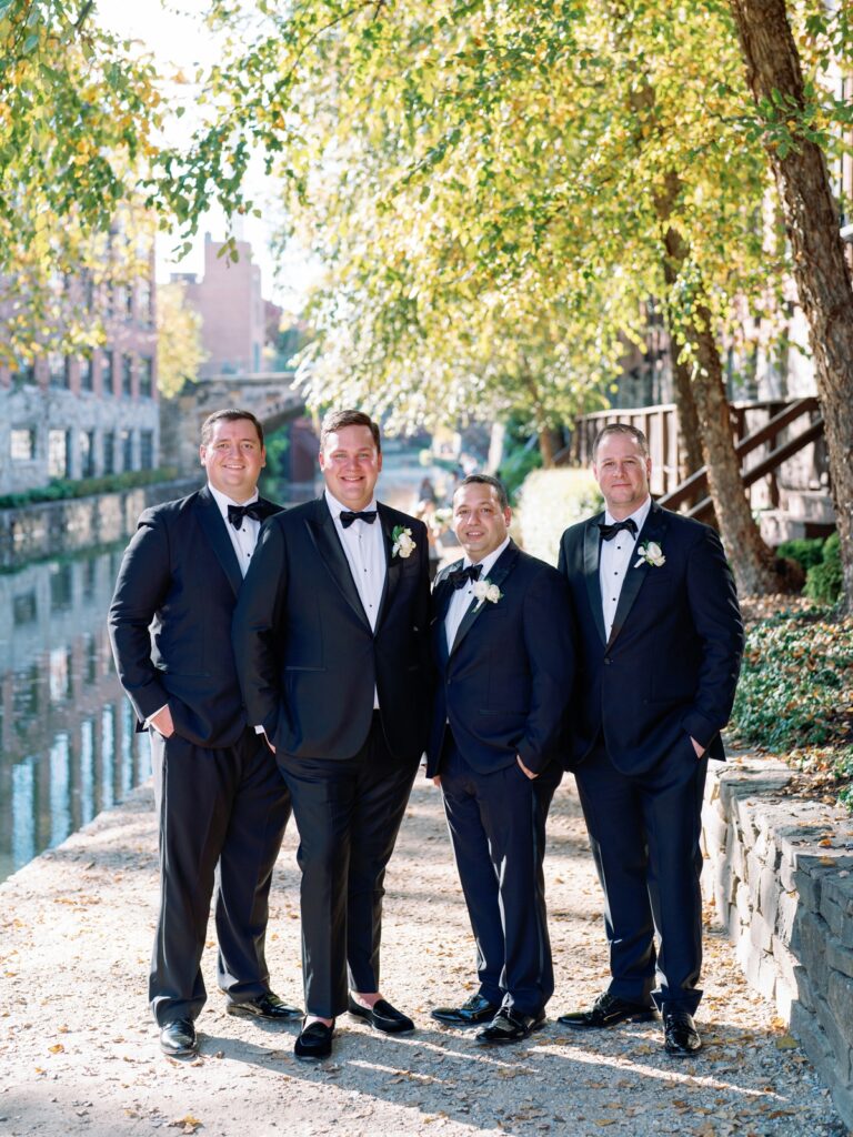 groomsmen smiling at the camera in georgetown