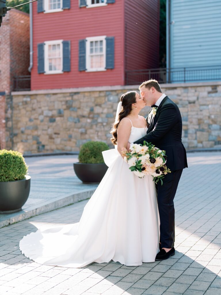 bride and groom kissing at the Ritz carlton georgetown in washington dc
