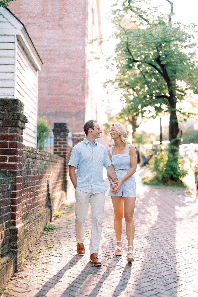 Couple smiling at each other in old town alexandria