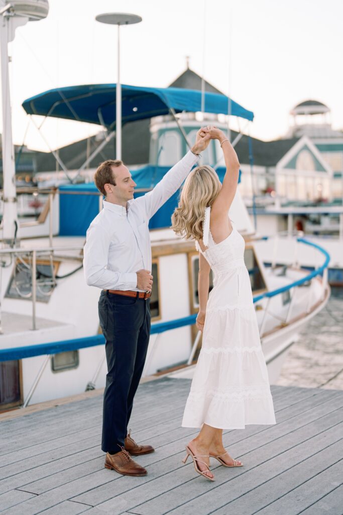 Couple dancing in old town alexandria walking along the waterfront