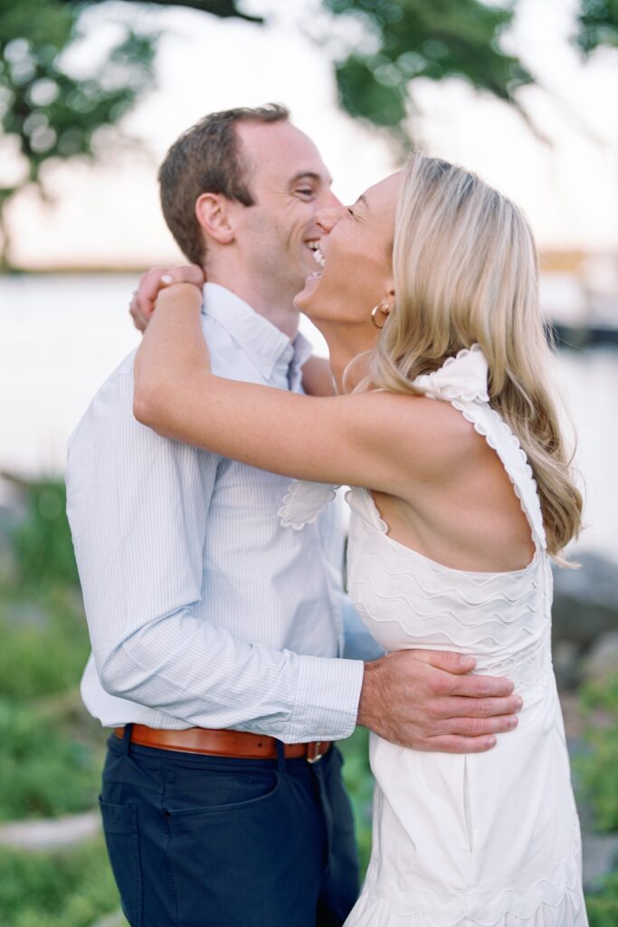 Couple laughing in old town alexandria walking along the waterfront